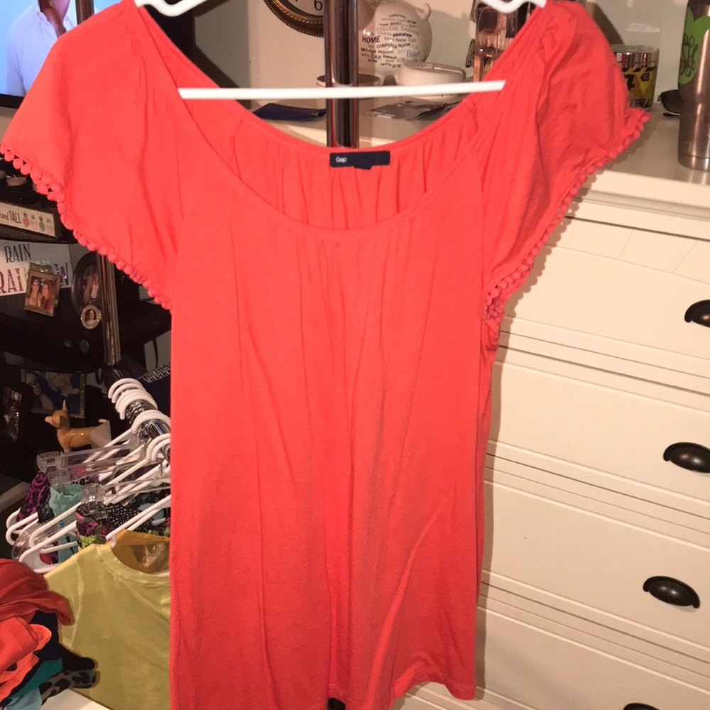 Orange top with frills on sleeves